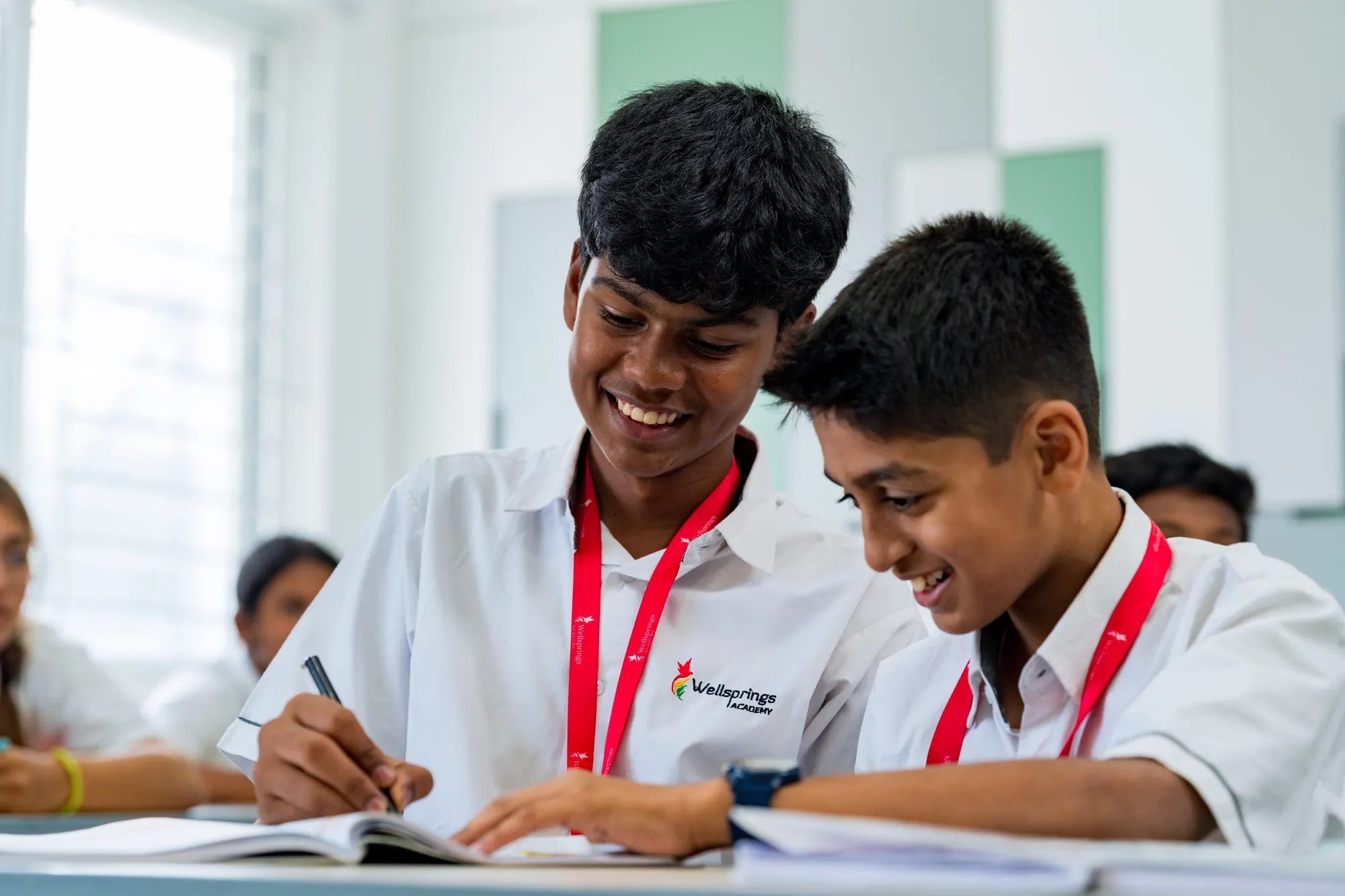 Two students over one notebook