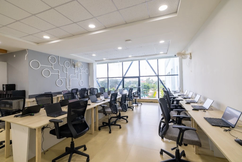 The computer lab with rows of laptops