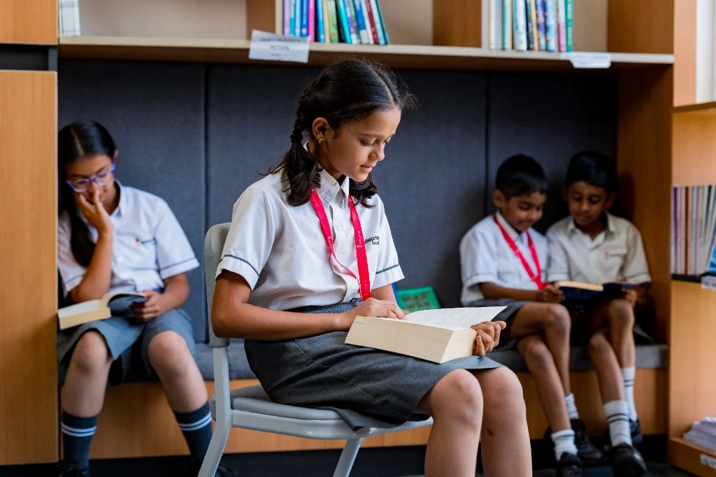 A Wellsprings student reading in the library